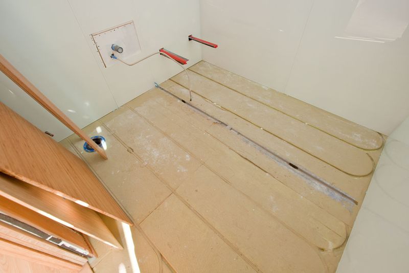 Team California Refract House for 2009 Solar Decathlon: Preparation for the Warmboard Radiant Panel Which is Also Serving as the Structural Subfloor in the Bathroom. (Photo by Oliver Shay)