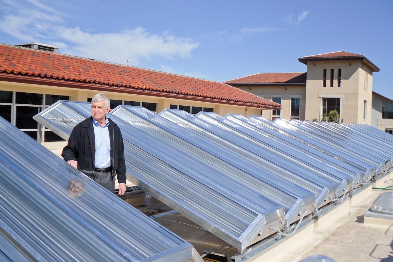 Mr. Joe Sugg, Assistant Vice President of University Operations of Santa Clara University, stands amongst the newly inaugurated solar collectors (Chromasun Micro-Concentrator (MCT)) which are part of the 120- kW concentrating solar thermal system located on Santa Clara University’s various building rooftops. (Photo courtesy Santa Clara University)