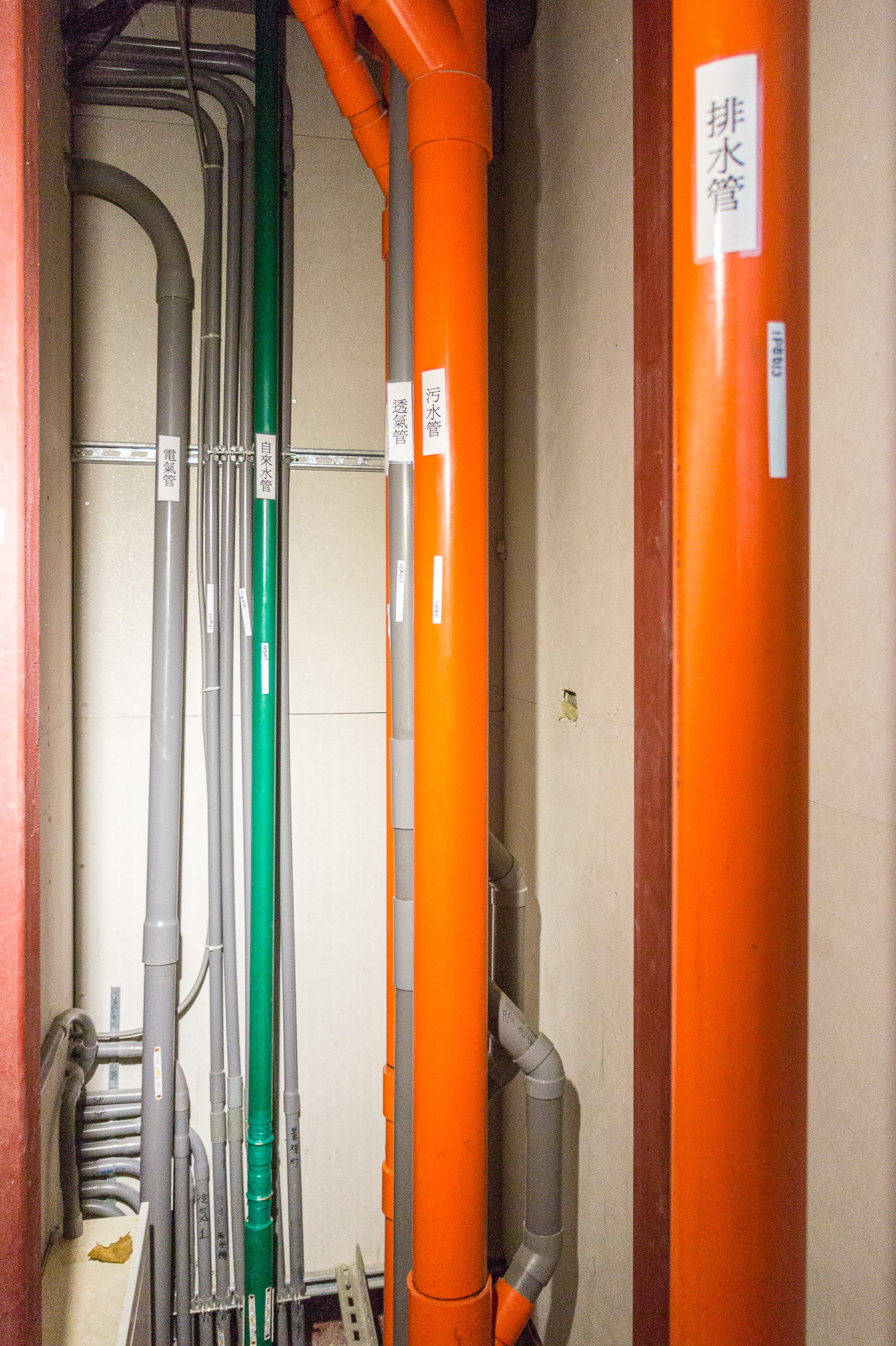 MEGA House, Taipei, Taiwan: Plumbing pipes and electrical conduits are clearly labeled and RFID tags are adhered to the plumbing pipes. (Photo by Mignon O’Young)