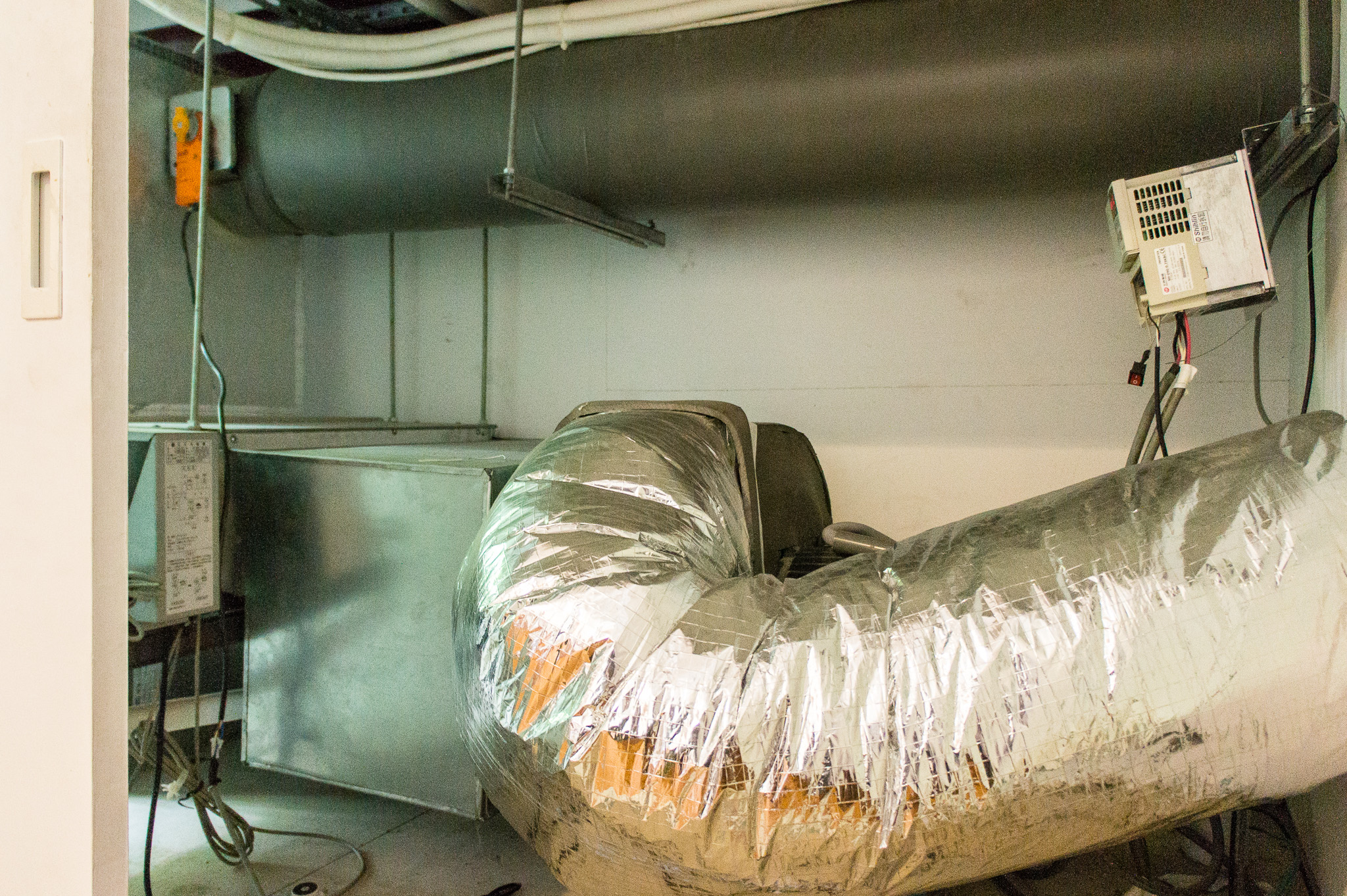 Duct work is connected to the earth tube located outside (164 ft long x 15 inches in diameter and 13 ft below ground) and brings fresh air into the MEGA House after it gets filtered through the nano-air filter. (Photo by Mignon O’Young)