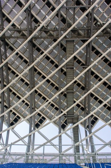 The multi-layered canopy at the Taiwan National Stadium shows the intricacy of combining a spiraling framework, complimentary structural members, BIPV panels, and access for maintenance. (Photo by Mignon O’Young)