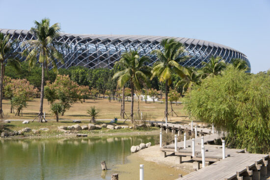 The Taiwan National Stadium complex can be reached from all four sides of its urban eco-park, including this wooden footbridge that crosses over one of two eco-ponds. (Photo by Mignon O’Young)