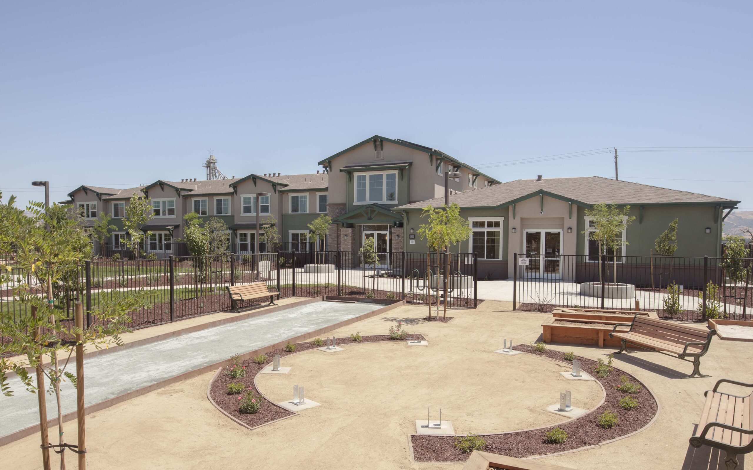 Outdoor facilities at Gilroy Sobrato Apartments include basketball, bocce ball, and horseshoe courts. (Photo by Douglas Sterling)