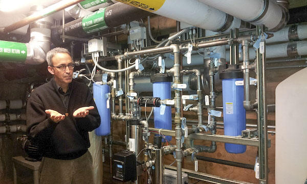 Seattle SBA Program students toured one of the greenest commercial buildings, the Bullitt Center in Seattle, Washington. Tour guide Rob Peña talks about the filter units for the rainwater collected from the roof for re-use inside the building and for irrigation. (Photo courtesy SBA Program)
