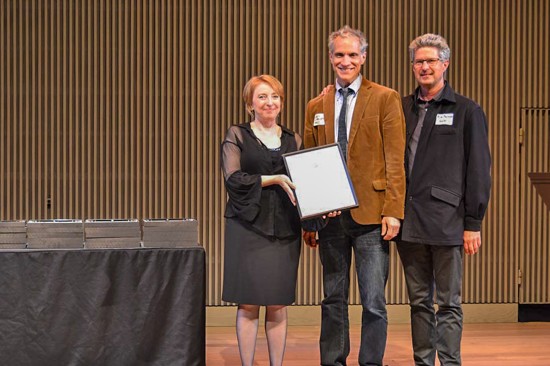 Marianne O'Brien, the President of AIA San Francisco’s Board of Directors presents the Energy + Sustainability Honor Award to architects Marc L'Italien and Rick Feldman representing EHDD. (Photo courtesy AIA SF)