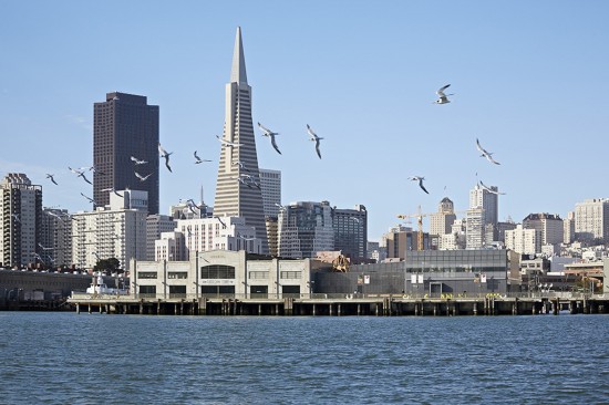 The San Francisco skyline serves as a backdrop for the new Exploratorium located in a historic pier building and designed by EHDD. (Photo by Bruce Damonte)