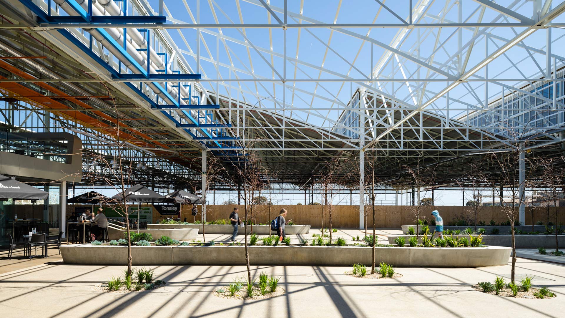 One of the many courtyards in the Tonsley Main Assembly Building and Pods adaptive reuse, mixed-use project in Clovelly Park, Australia. (Photo courtesy Woods Bagot)