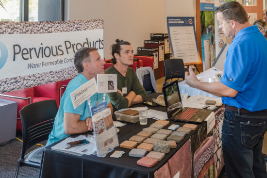 Representatives from Pervious Products dispense information on their water permeable concrete products at the 2017 Beyond Energy Efficiency Conference. (Photo courtesy Build It Green)