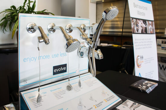 Exhibitor Evolve Technologies features its core technology, ShowerStart, a small thermostatic shut-off valve that eliminates behavioral waste by saving the water and energy that is used while users wait for their shower water to become warm. (Photo by Mignon O’Young